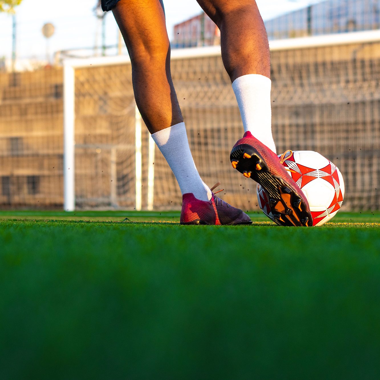 Player kicking a ball on the field